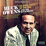 Download or print Buck Owens I've Got A Tiger By The Tail Sheet Music Printable PDF 3-page score for Country / arranged Piano, Vocal & Guitar (Right-Hand Melody) SKU: 52637