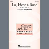 Download or print Traditional Carol Lo, How A Rose (arr. Nancy Grundahl) Sheet Music Printable PDF 10-page score for Christmas / arranged SSA Choir SKU: 407588